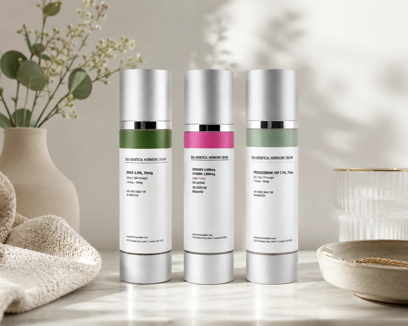The three bio-identical hormone cream bottles — DHEA, Estradiol and Progesterone